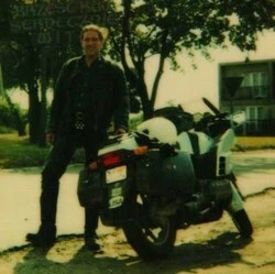 Man and his BMW motorcycle outside the town of Brzesc Kujawski, Poska on the site About Anthony Mrugacz.