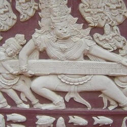 Khmer god pulls on a giant snake in a Phnom Penh temple.